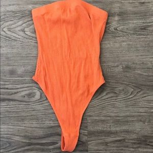Urban Outfitters orange strapless ribbed bodysuit: